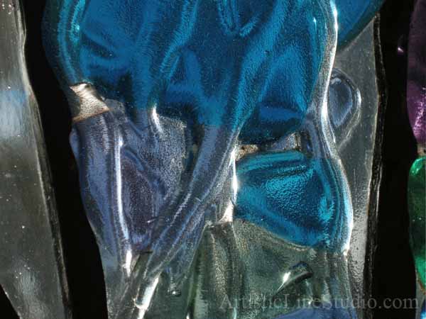 Stained, fused and leaded glass sculpture for the foyer window of a private residence