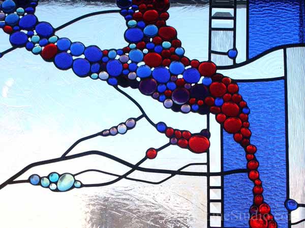 Stained and leaded glass window panel for a family room with fireplace to block unpleasant view  adding privacy and beauty