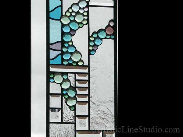 Modern stained, beveled and leaded glass window panels with nuggets and bevelled glass for a family room adding privacy and beauty 