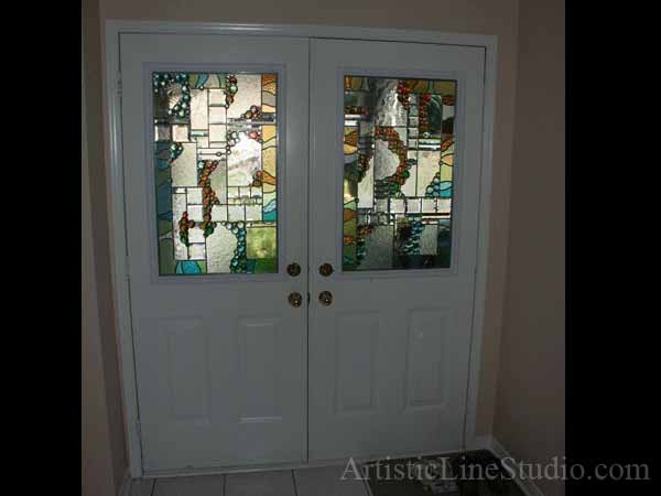 Stained and leaded glass oval foyer windows and enrance door lights with nuggets and bevelled glass