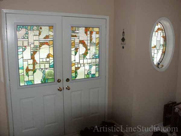 Stained and leaded glass oval foyer windows and enrance door lights with nuggets and bevelled glass