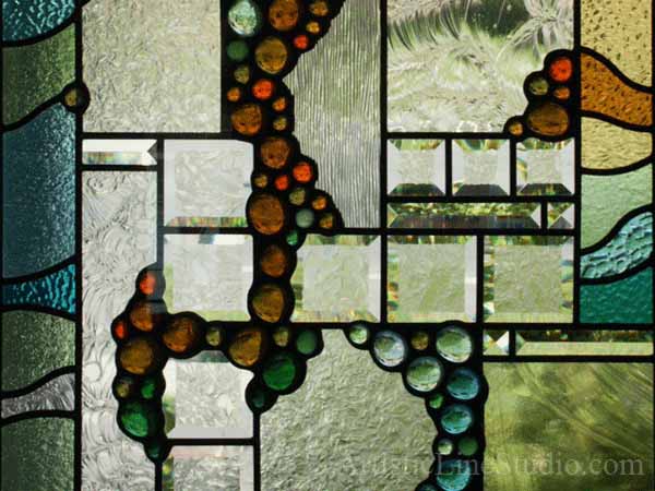 Stained and leaded glass oval foyer windows and enrance door lights with nuggets and bevelled glass