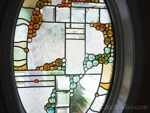 Stained and leaded glass oval foyer windows and enrance door lights with nuggets and bevelled glass