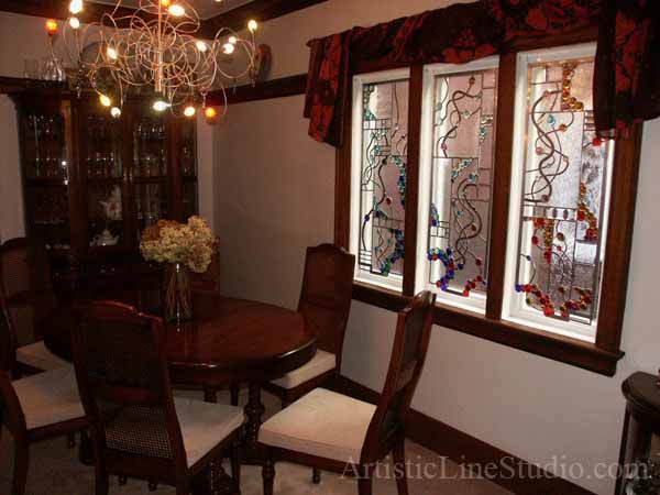 Stained and leaded glass free shape suspended panels with nuggets and bevelled glass