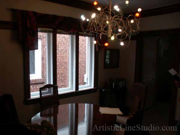 Stained and leaded glass free shape suspended panels with nuggets and bevelled glass
