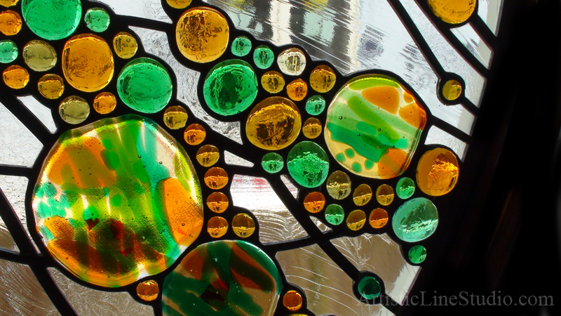 Stained leaded glass oval window in contemporary abstract style by glass artist Victoria Balva