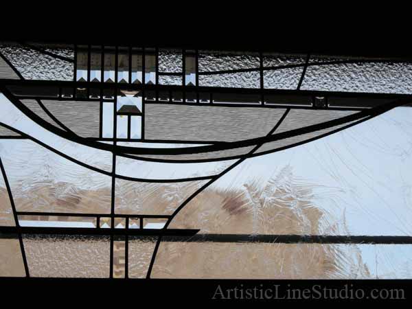Stained and leaded glass bedroom window with jewels and beveled glass adding prinacy and beauty