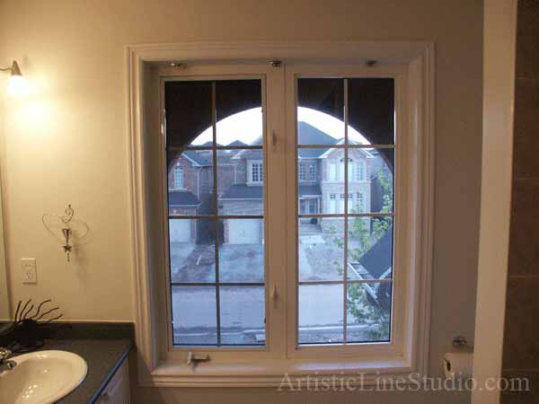 Stained and leaded glass bathroom window with jewels and beveled glass adding prinacy and beauty