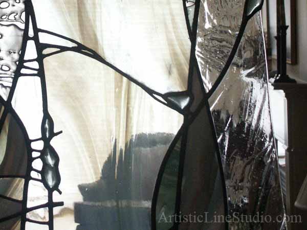 Stained and leaded glass free shape wall divider with kiln formed glass elements