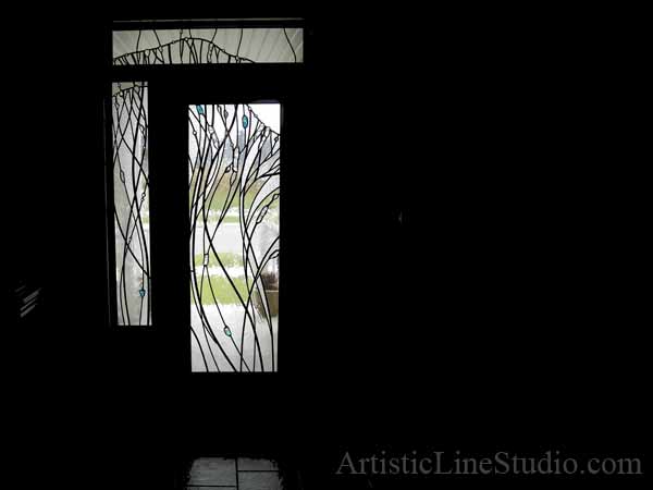 Stained, fused and leaded glass doorlights for the entrance of a private residence