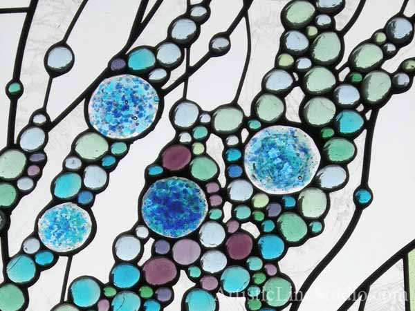 Contemporary stained, fused leaded glass windows for a foyer / staircase  close up window