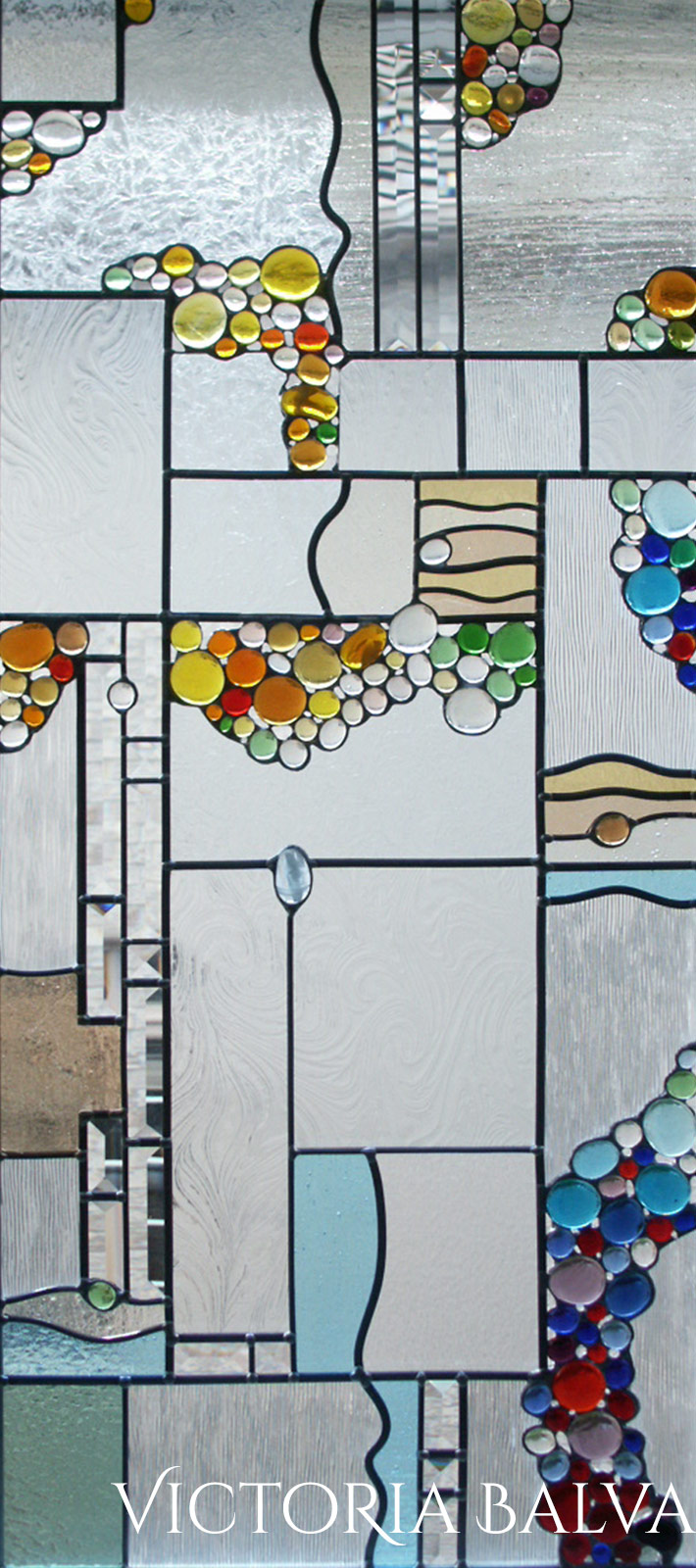 Contemprorary abstract stained, beveled leaded glass windows detail with globes and beveled glass