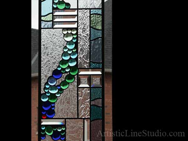 Beatifull abstract stained, beveled  and leaded glass window panels with nuggets and bevelled glass for a family room adding privacy and beauty