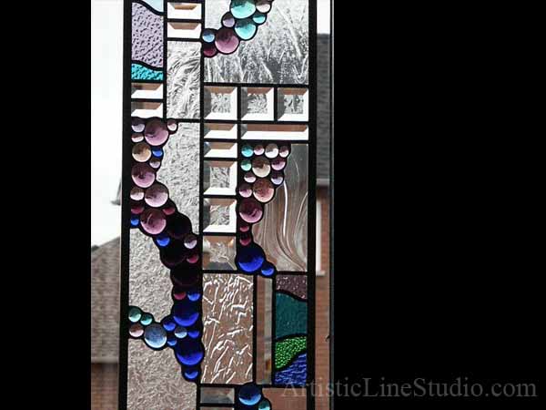 Stained and leaded glass window detail with nuggets and bevelled glass for a family room adding privacy and beauty