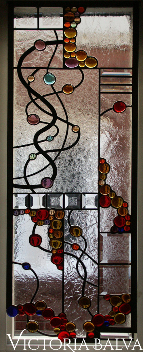 Modern style stained, beveled and leaded glass free shape suspended panels with nuggets and bevelled glass