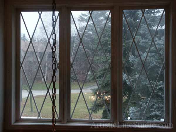 Stained, beveled leaded glass foyer windows with mouthblown glass before installation
