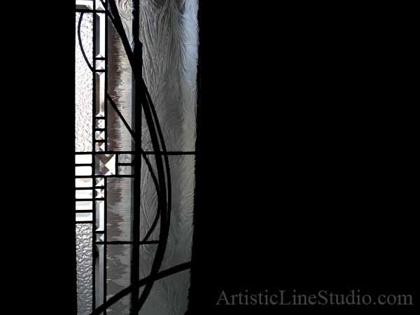 Modern stained glass front door detail with large jewel