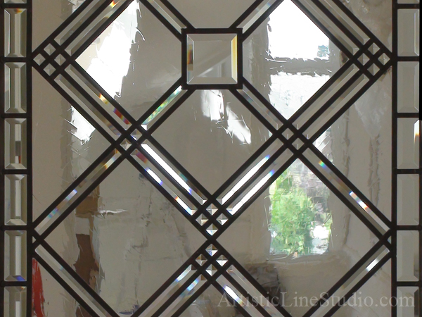 Stained and leaded glass office door light with beveled  and spectrum artique glass detail